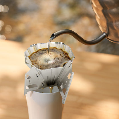 iKoffy Coffee Dripper in an outdoor setting, showcases its compact design and durability for camping and travel brewing.