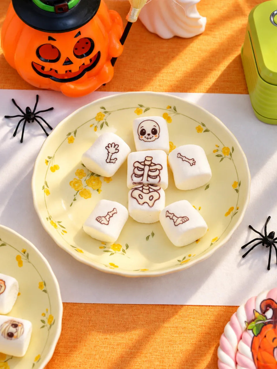 Printed marshmallows arranged as a Halloween skeleton.